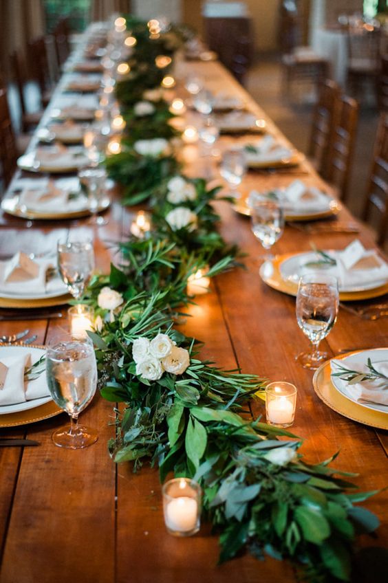  Rustic garland and candle covered wedding tables 